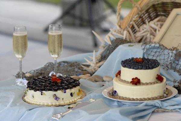 A delicious assortment of cakes served as centerpieces for the tables.