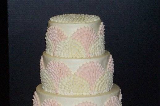 Frosted in all buttercream, this cake is a recreation of a Martha Stewart cake by Wendy Kromer.  Serves 118 as shown.