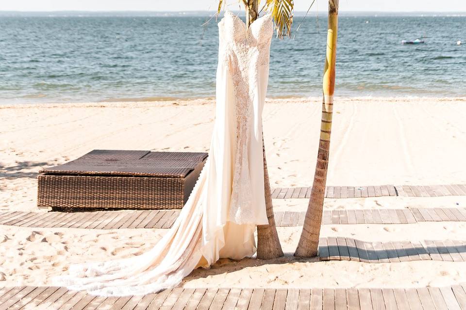 Bride's dress hanging at beach