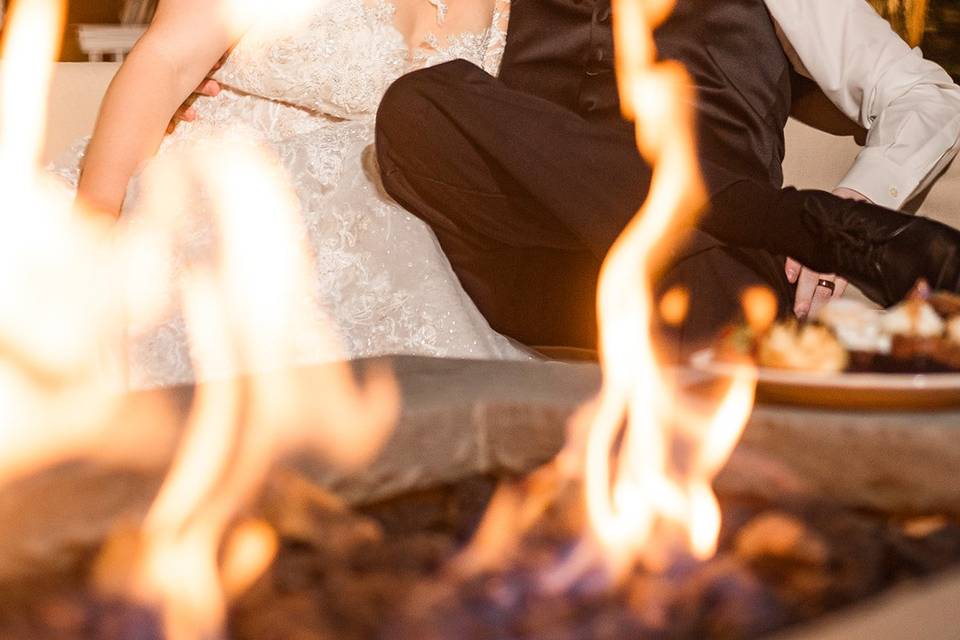 Couple kissing by fire