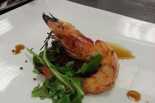 Simple head on shrimp with an arugula salad with a soy vinaigrette