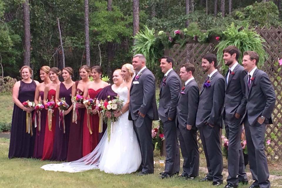 The newlyweds with the wedding attendants