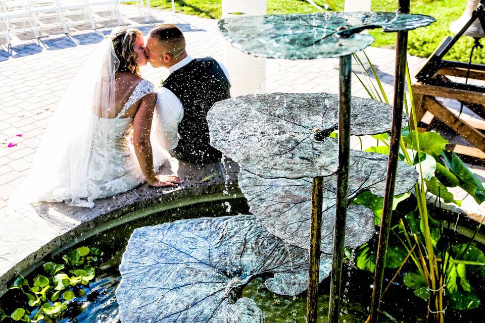 Bride & groom with the trickling water in the background