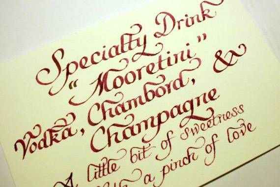 Have a signature drink during your cocktail hour? Tell guests what's in in with a bar menu sign in calligraphy!