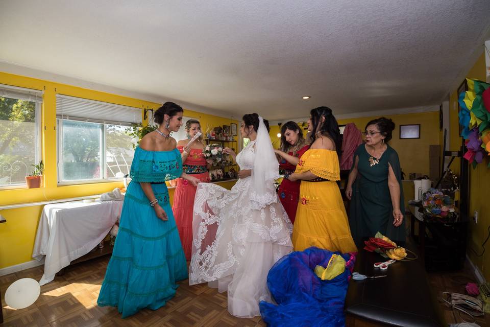 Bride getting into her dress