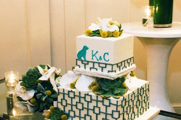 Wedding cake with custom beagle silhouettes and geometric design, succulents, and orchids