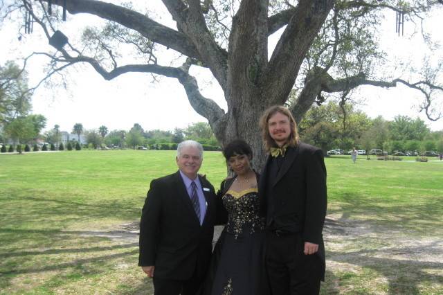 Newlyweds and officiant