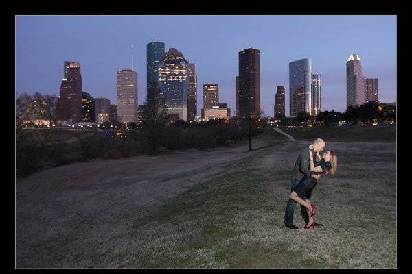 Engagement session at Eleanor Tinsley Park with Downtown Houston skyline at dusk.