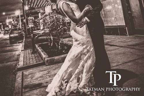 Couple embracing by the bridge - Tatman Photography