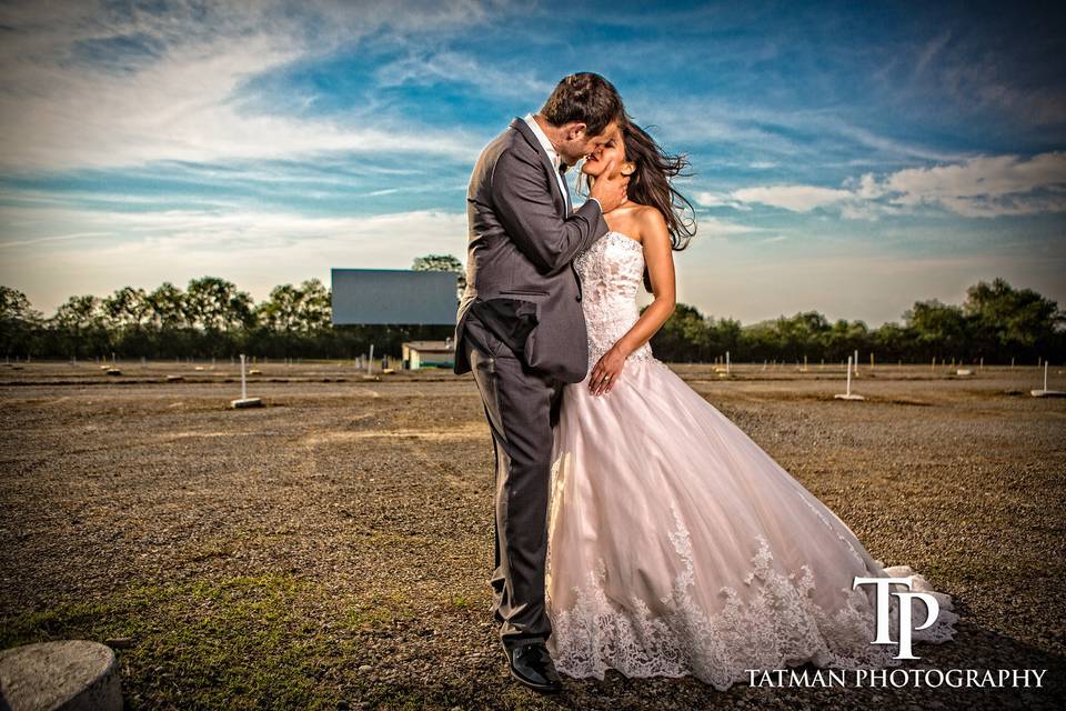 Couple share a kiss - Tatman Photography