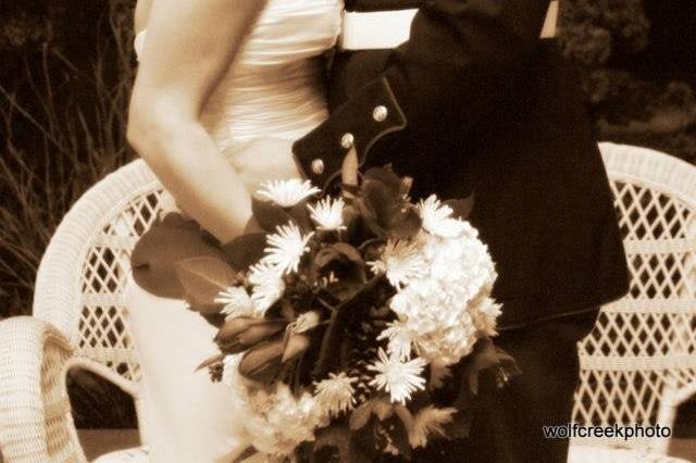 Groom kissing the bride's forehead