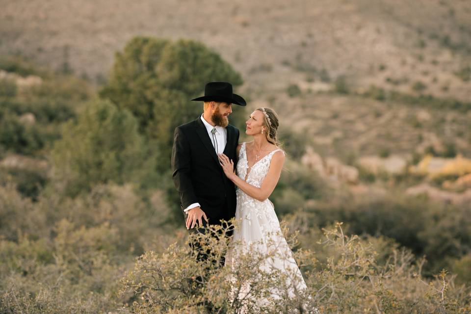 Couple in red rock meadow