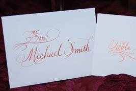 Copper Ink lettered with a flourish on white Crane Escort envelopes and cards.