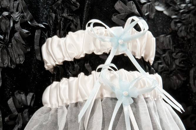 Handmade garter imported from Italy with blue ribbon details