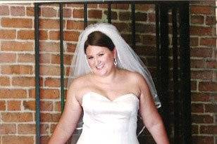 Bride and brick wall