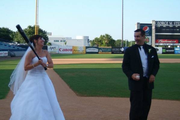 The couple having fun on-field after the ceremony