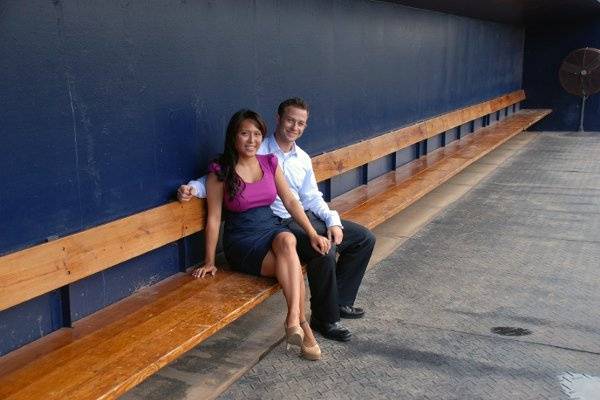 Marisa and Jeff having fun with their photo shoot on stadium grounds