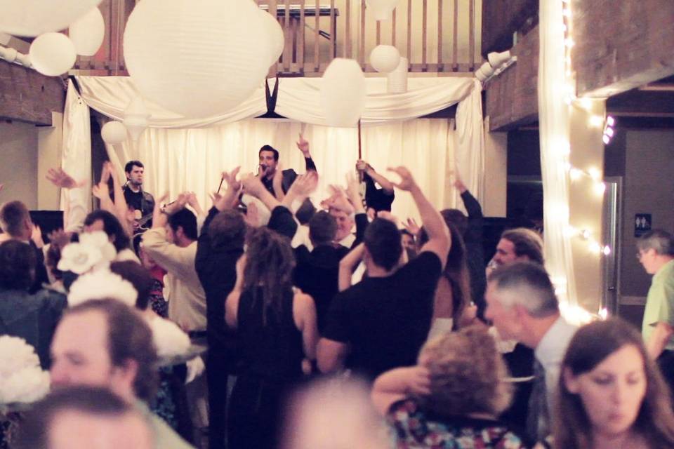 Bride and their guests dancing