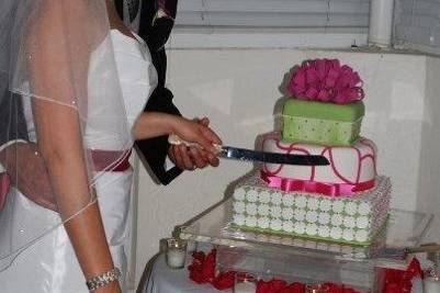 Couple cutting their wedding cake