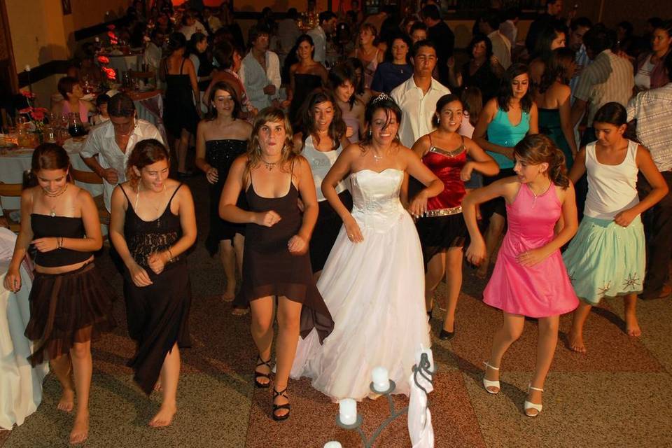 The bride dancing with guests
