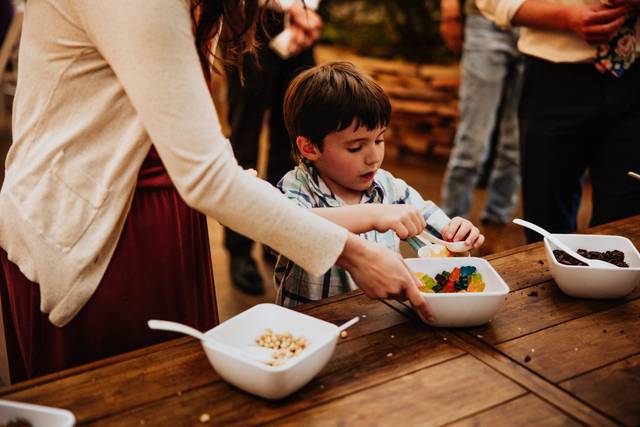 Guests choosing toppings