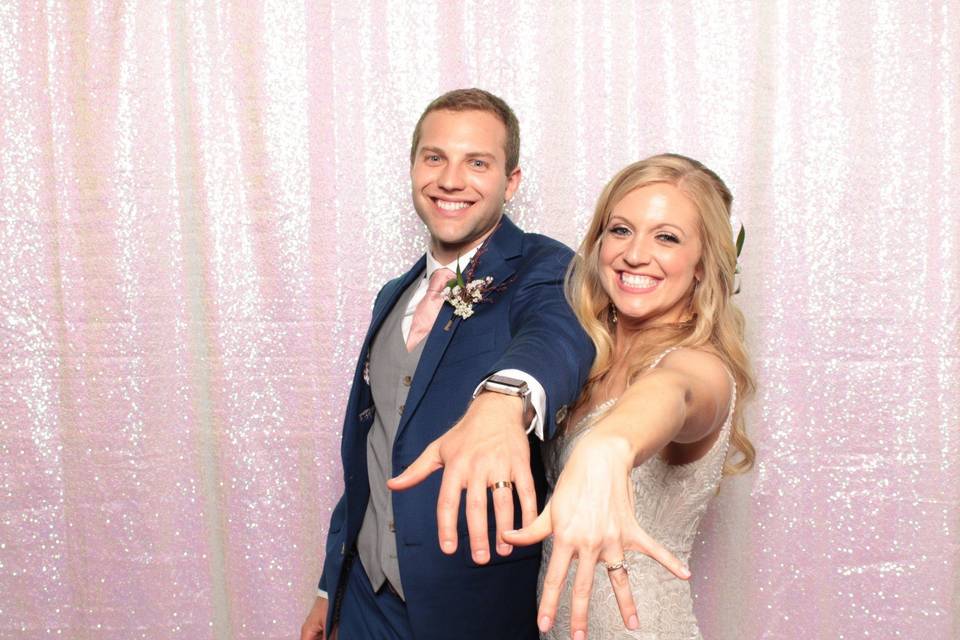 Photo booth with pink backdrop