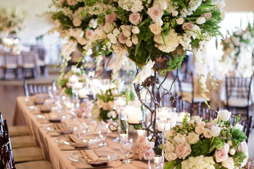 Indoor long table setup with flower decors