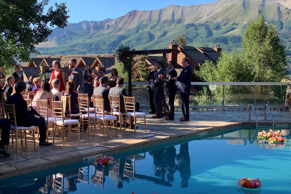 Poolside terrace wedding ceremony