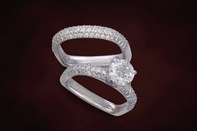 Domed pave set round brilliant cut diamonds in this matching wedding set with designer ring bottom. Prevents the rings from turning when worn and they are tailor fit to your finger.