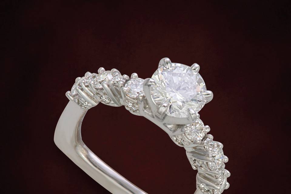 Large and small diamonds accent the top and fronts of this designer ring.  Prevents the rings from turning when worn and they are tailor fit to your finger.
