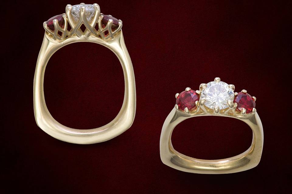 Yellow gold three stone ring with diamond center stone and red spinel accents in this designer ring, created to prevent the ring from turning when worn and it is tailor fit to your finger.