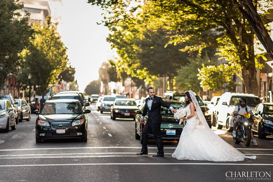 Bride and groom crossing the road