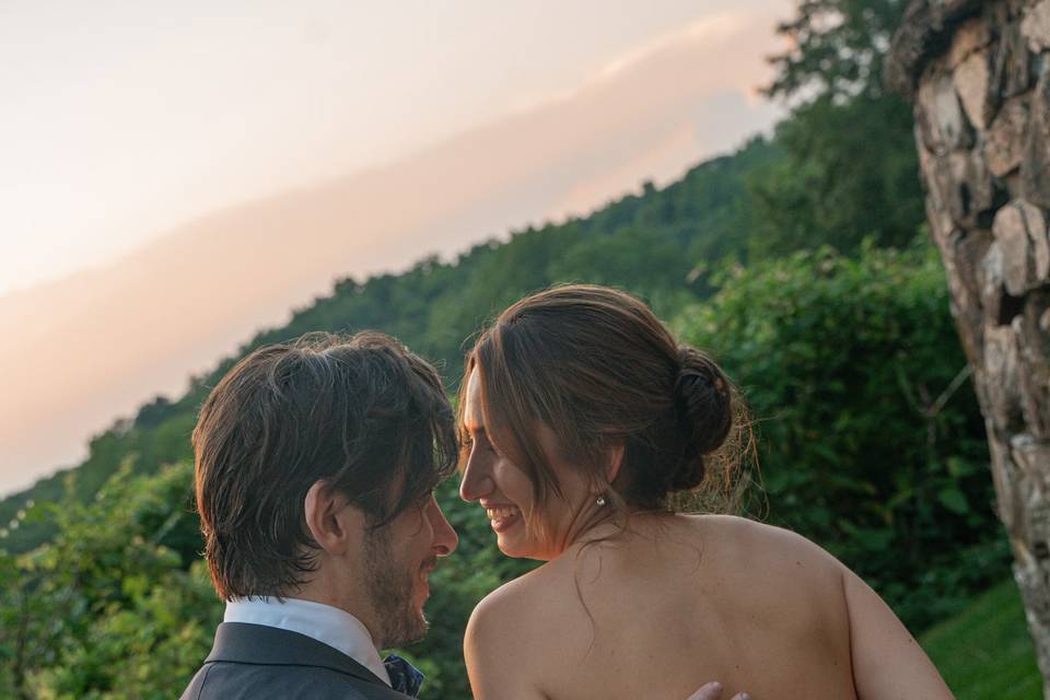 Groom holds brides back