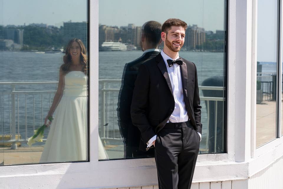 Groom admiring wife