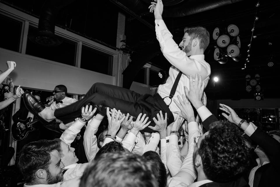 Groom crowd surfing