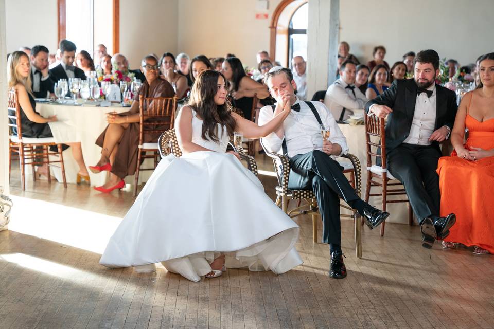 Groom kisses brides hand