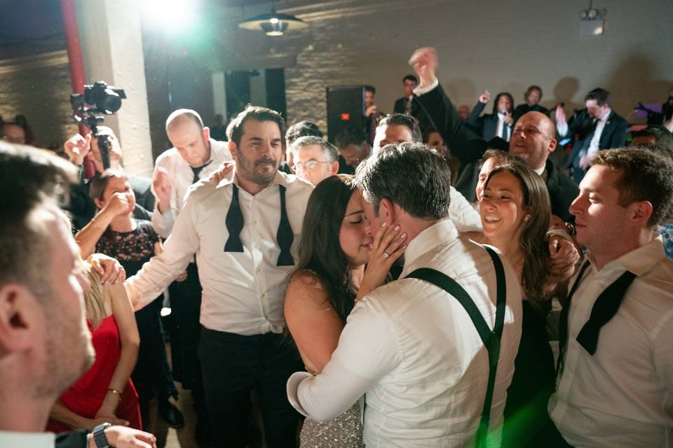 Bride holds grooms face