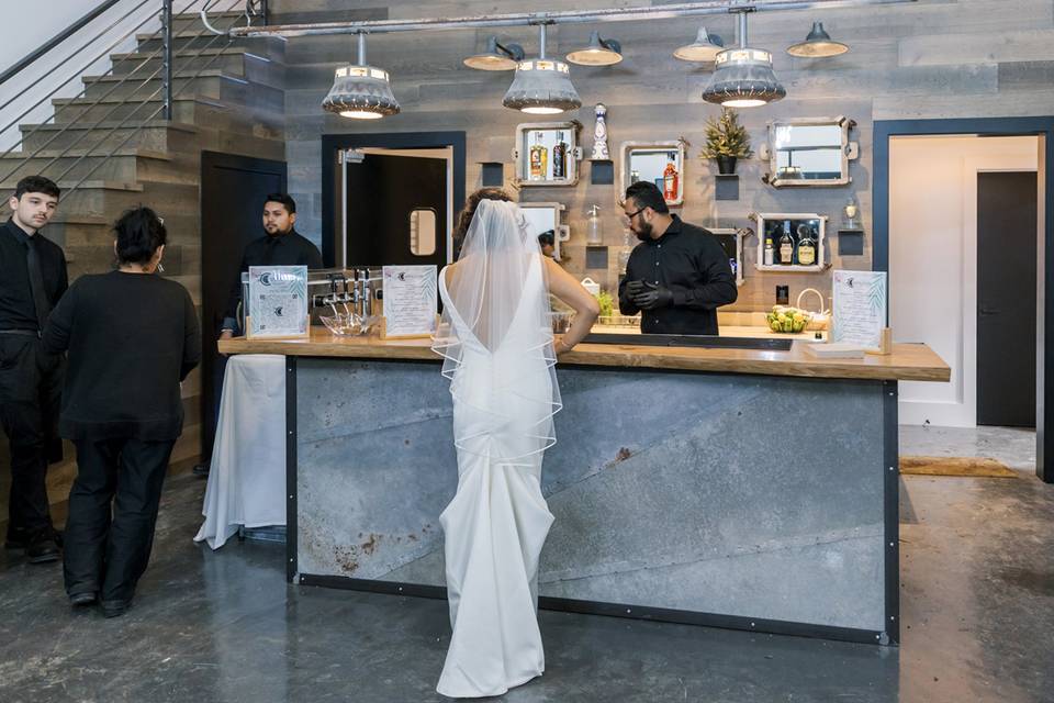 Bride by the reception bar