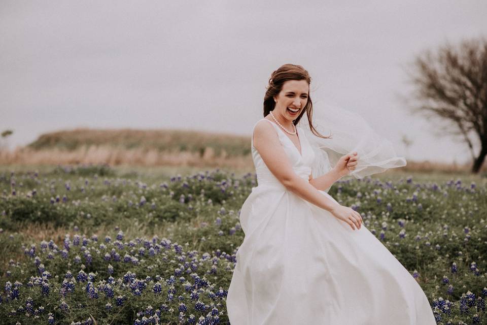 A twirl in the dress before a field of flowers