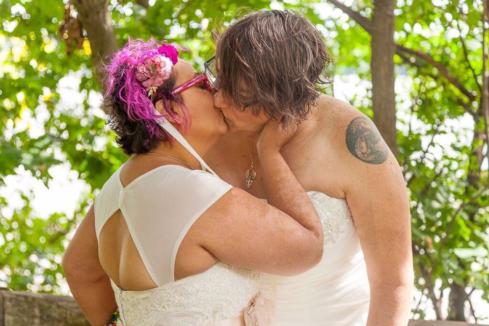 Brides kissing