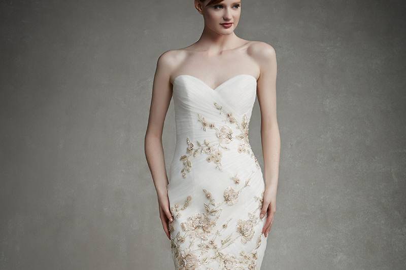 Enzoani Judy
<br> Romantic lace over a tulle mermaid skirt is enhanced with a classic sweetheart neckline, thin beaded spaghetti straps, and intricate beaded embroideries over lace appliqués on the bodice. Hem lace and a low back with invisible zipper beautifully complete the look.