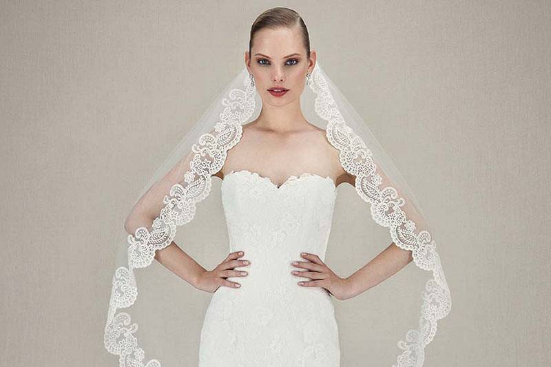 Style Kendall <br> Full-length mermaid Alencon lace and corded Chantilly lace gown features romantic sweetheart neckline and delicate scalloped hem lace on the tulle skirt.