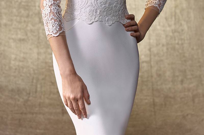 Style Jacket U	<br>	Add fabulous vintage flair to your bridal look with this jacket featuring intricate, gorgeous beaded embroidery and an eye-catching jeweled neckline atop soft tulle. Long, delicate sleeves provide all the timeless sophistication, and a crystal button closure ensures a breathtaking back.