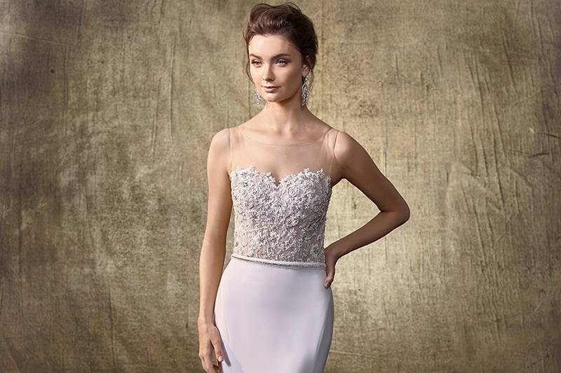Style Lala	<br>	The perfect mix of classic romance and modern drama. This full A-line gown creates the most flattering silhouette, with a soft sweetheart neckline bodice of delicate corded lace trailing down to an intricately beaded waistband and eye-catching three-tiered tulle train with horsehair hem. Crystal buttons along the back zipper complete the look.