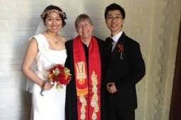 Bride and groom with their officiant