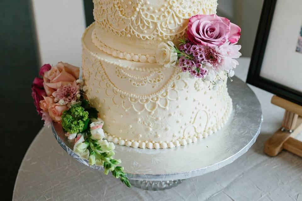 Wedding cake with lace detail and flowers