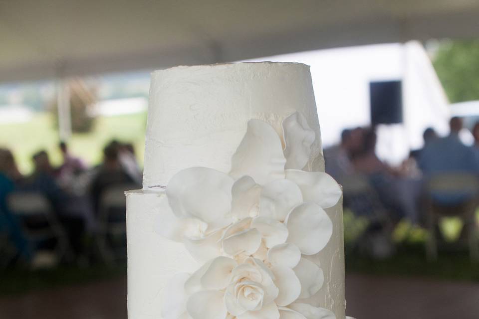 White wedding cake with white floral design