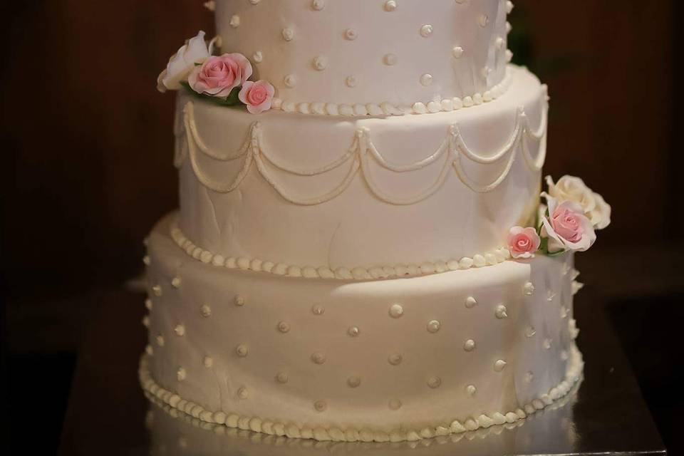 White wedding cake with white floral design