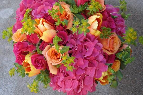 Bright pink, hot orange and lime green give this classic bride's bouquet a modern look