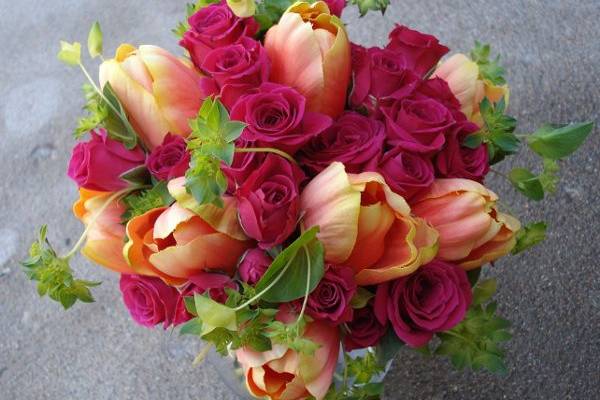 hot pink and bright orange compliment each other well in this vibrant bouquet